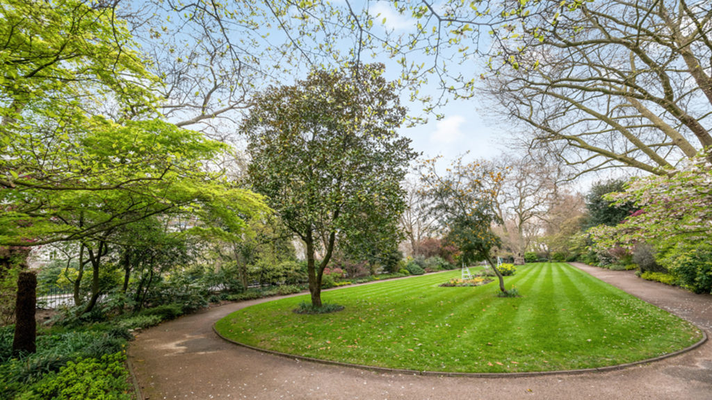 Outlet Residential London communal garden with lawn and trees